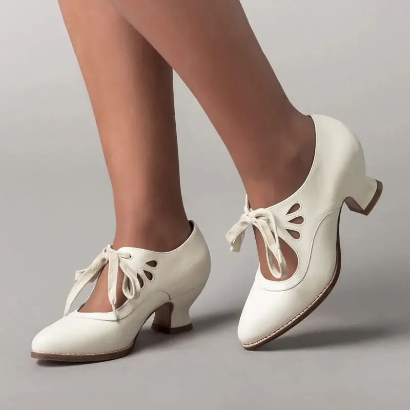 Women's flat cushioned sandals in neutral tone, graceful open-toe design with supportive sole
