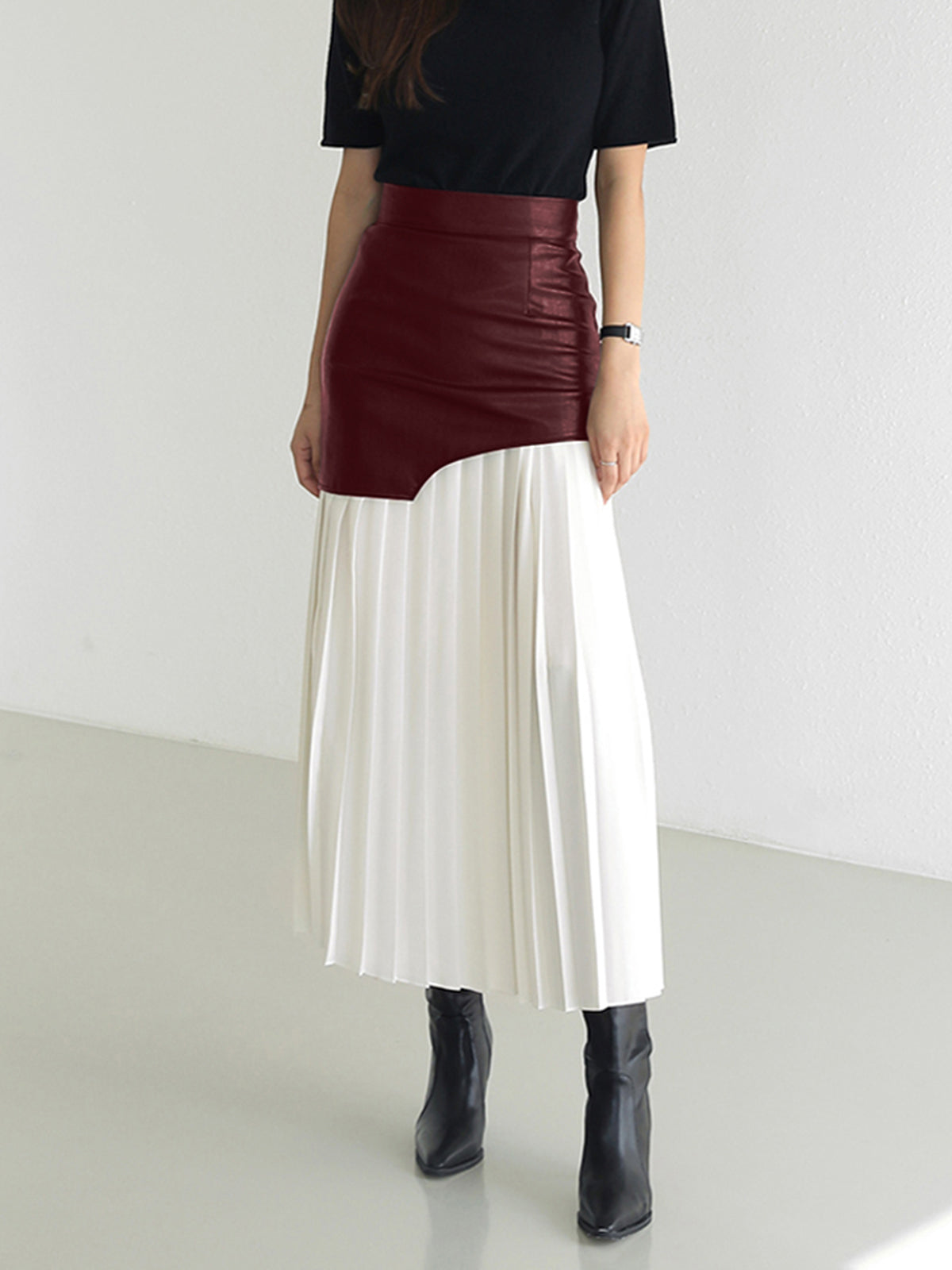 Black asymmetric patchwork midi skirt with faux leather bodice and pleated chiffon hem