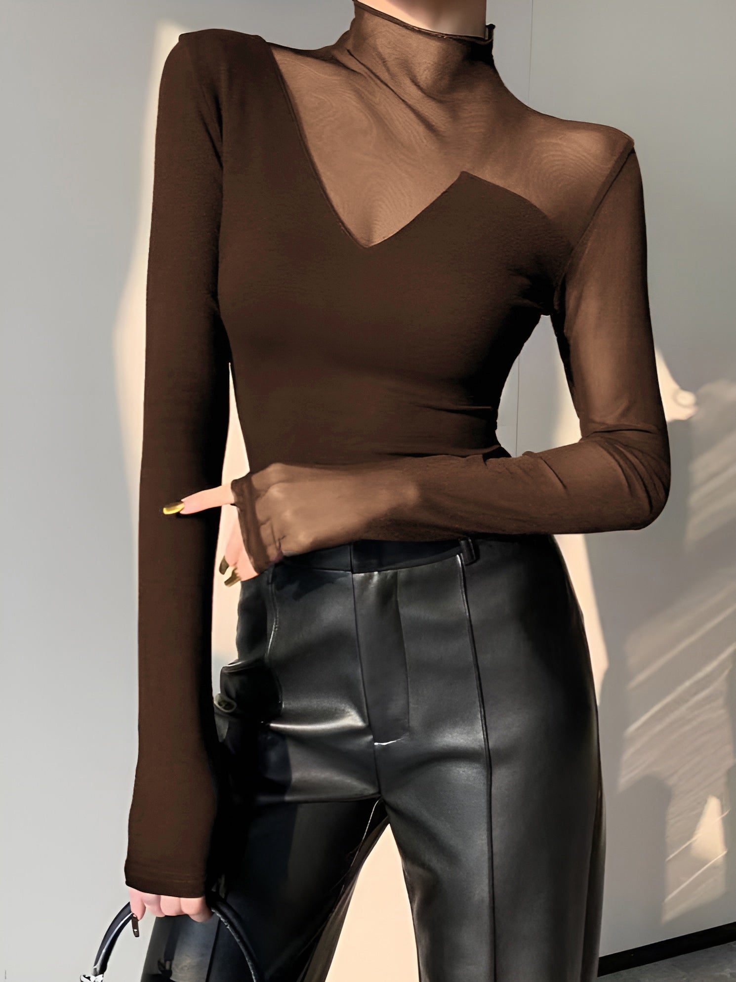 Black long sleeve mock neck skinny T-shirt with asymmetrical sheer mesh panel design
