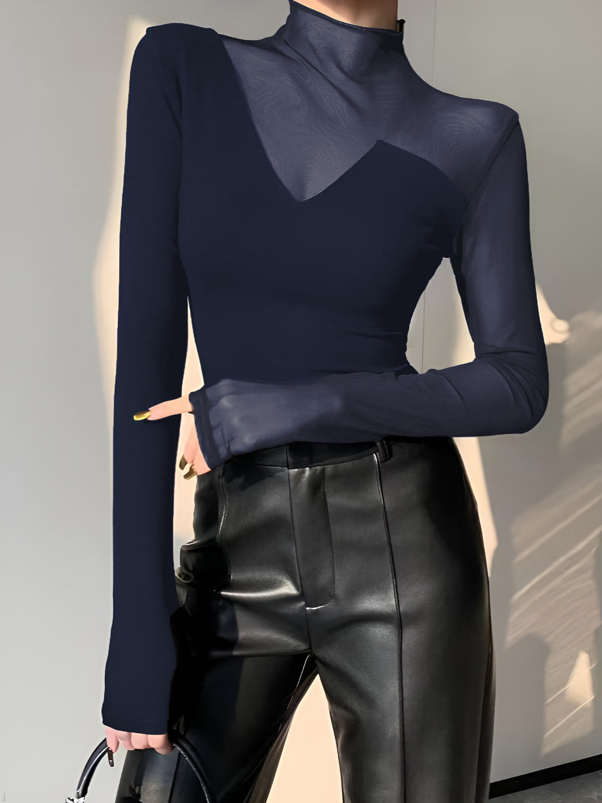 Black long sleeve mock neck skinny T-shirt with asymmetrical sheer mesh panel design