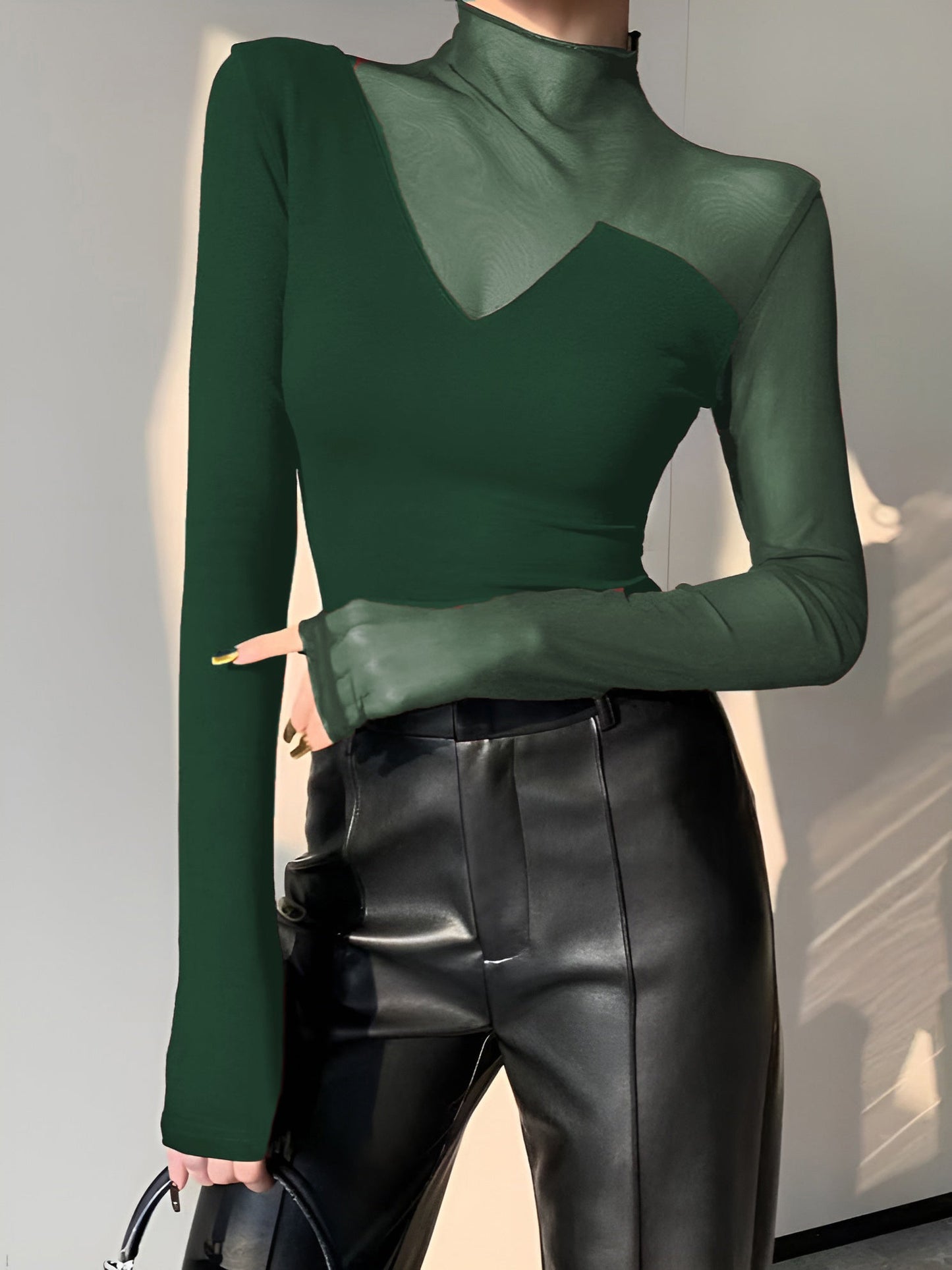 Black long sleeve mock neck skinny T-shirt with asymmetrical sheer mesh panel design