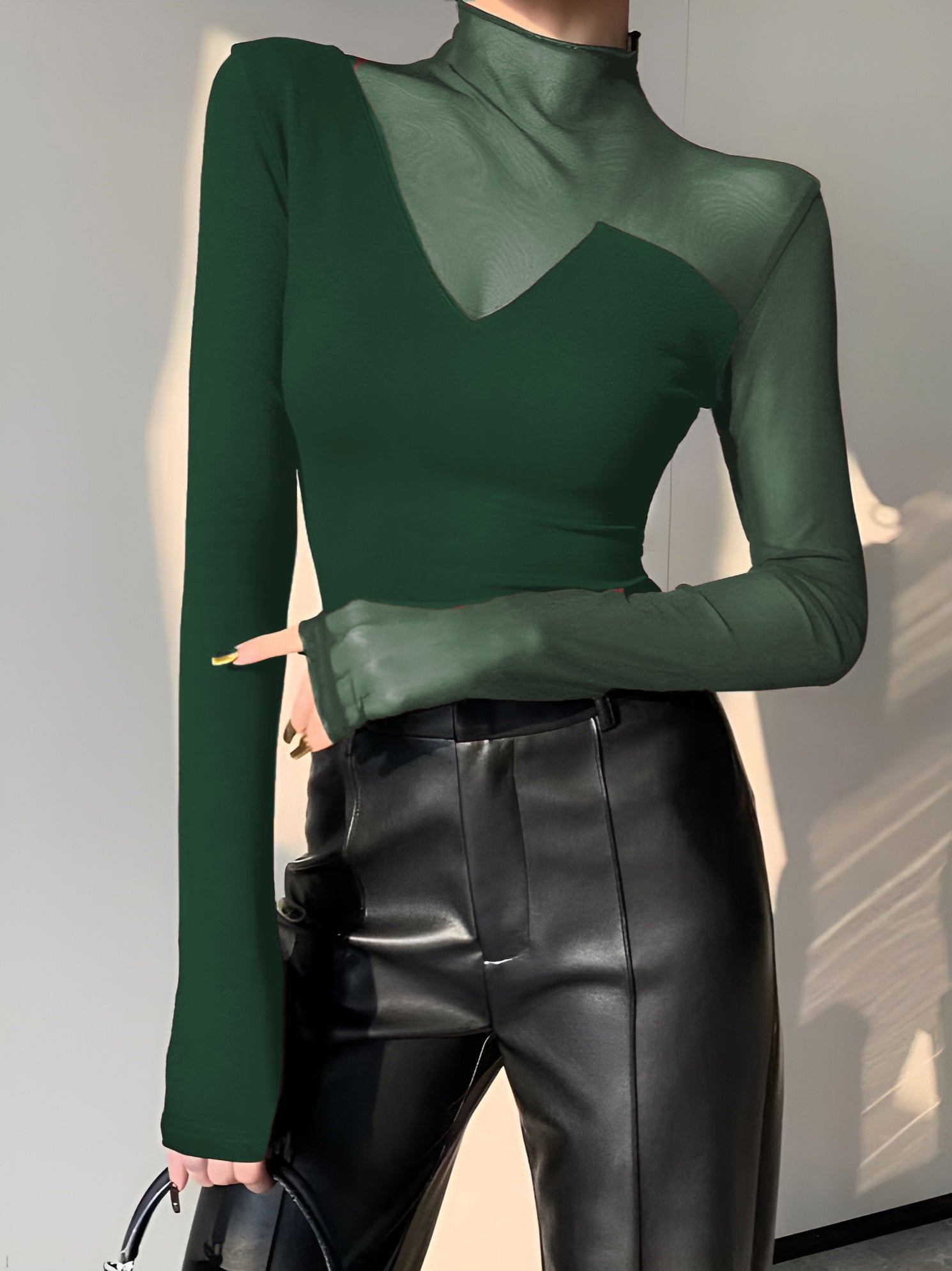 Black long sleeve mock neck skinny T-shirt with asymmetrical sheer mesh panel design