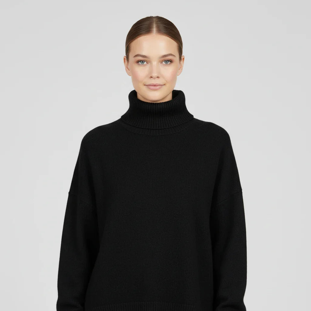 Women's oversized turtleneck knit sweater with drop shoulders, ribbed texture, and short sleeves