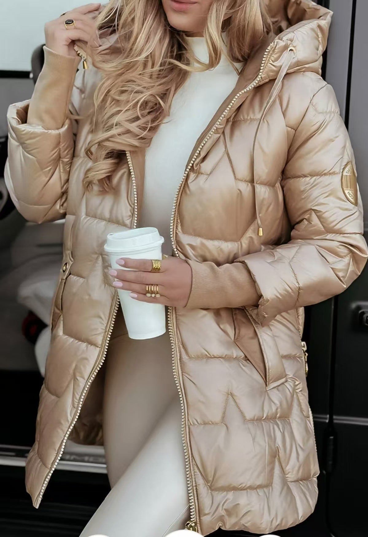 Unisex longline hooded puffer coat in neutral tones, insulated for winter with chic minimalist design