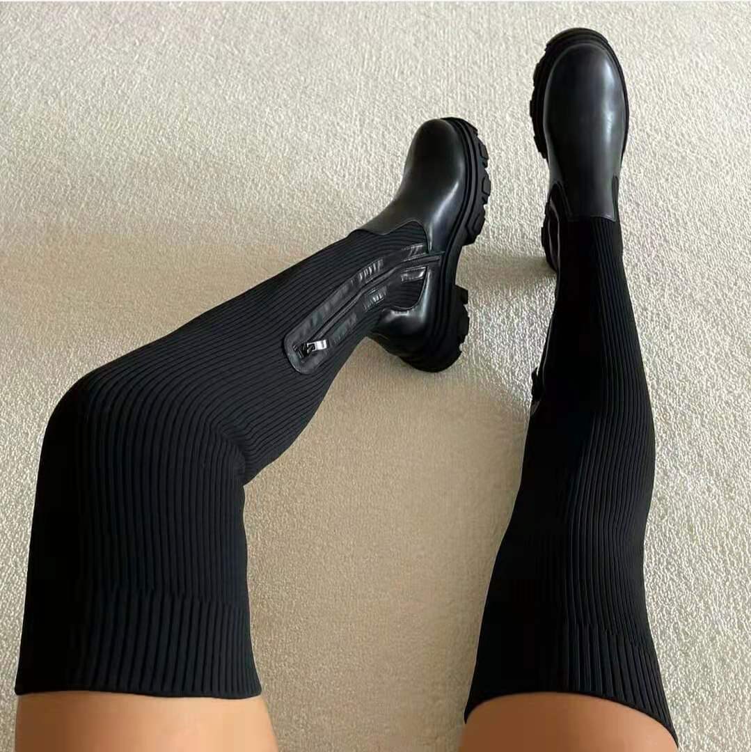 Black vegan leather knee-high boots with sturdy rubber platform sole for city-ready style
