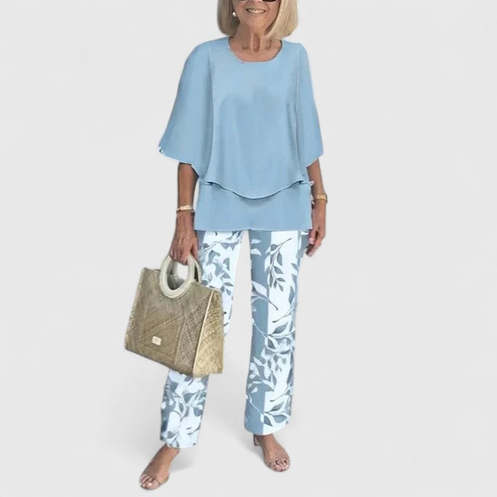 Sage green floral two-piece set with relaxed layered top and botanical print wide-leg pants