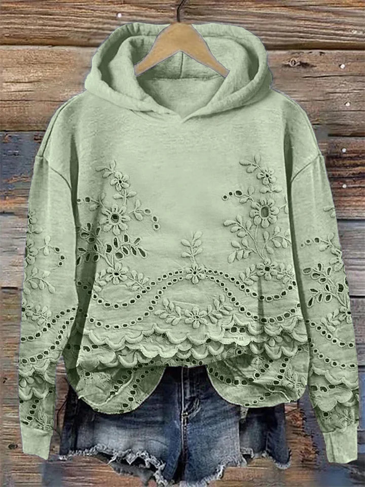 Relaxed-fit floral embroidered hoodie in soft tones, feminine casual style with delicate stitching detail