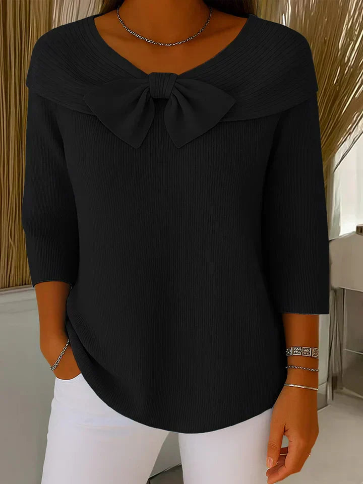 Soft feminine sweater with delicate bow accent detail, elegant chic style in violet tones