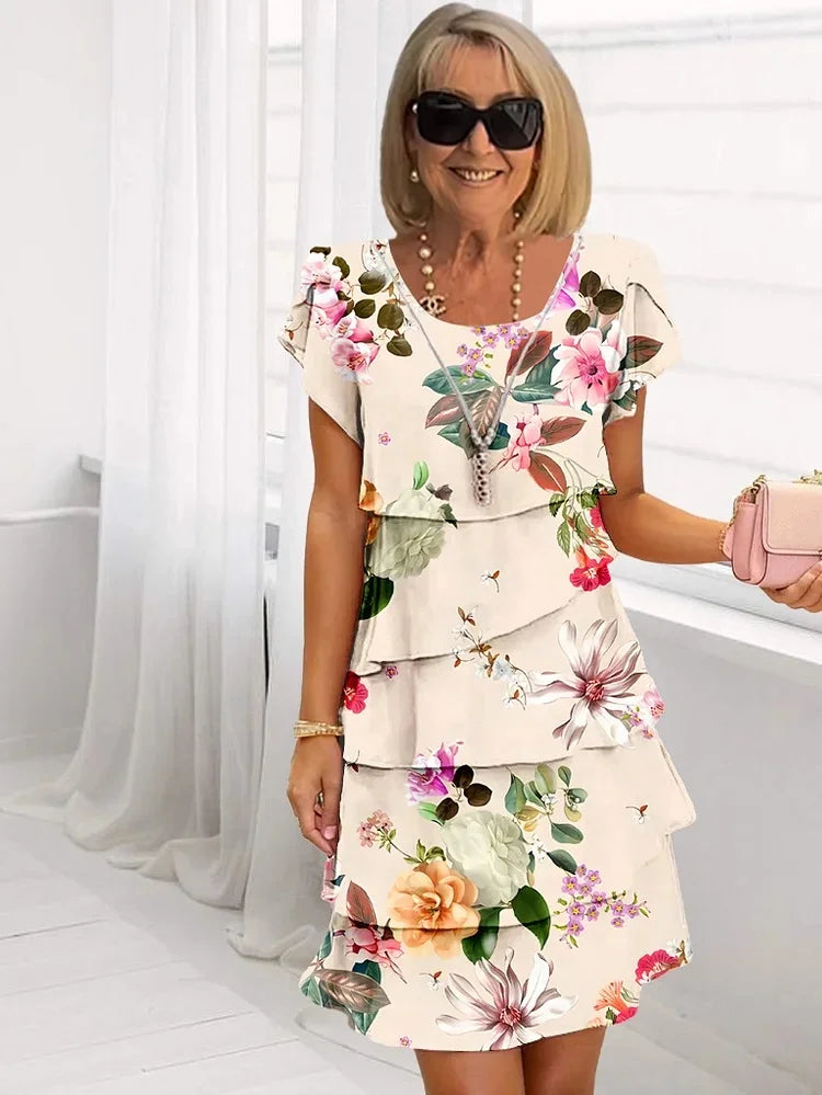 Floral pleated midi dress with ruffled neckline in soft feminine print for garden party looks