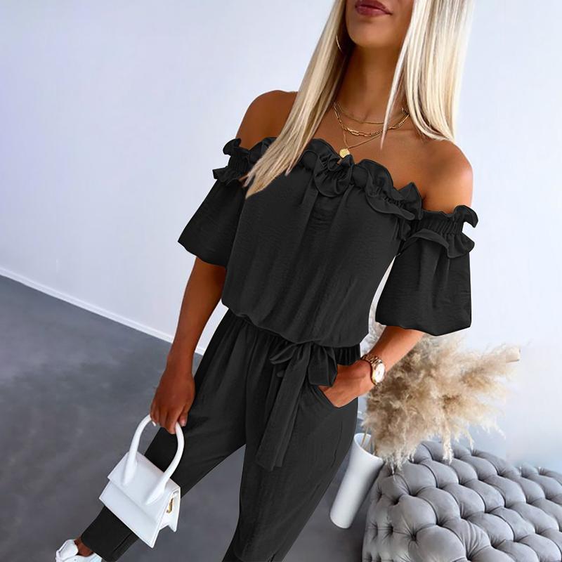 Black off-shoulder frill jumpsuit with tie-waist cinching detail, chic feminine silhouette