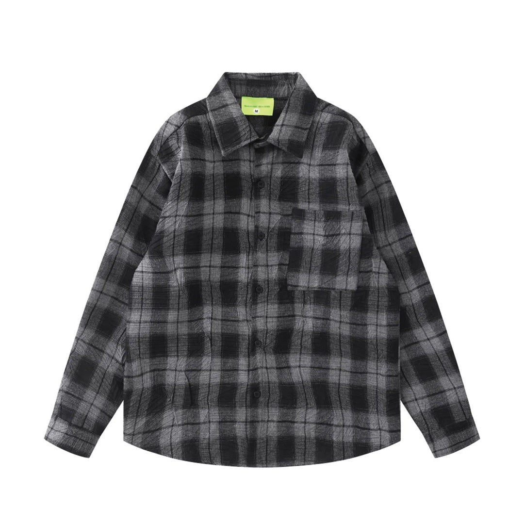Vintage loose-fit plaid flannel shirt in sun-faded tones with crinkled texture and lapel pocket