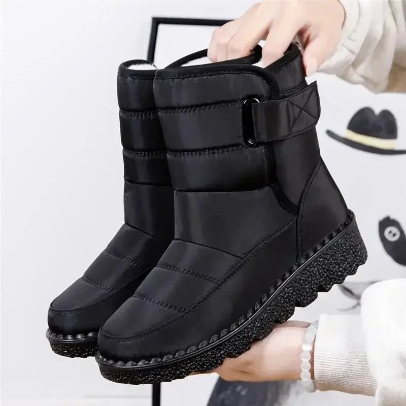 Women's black waterproof ankle boots sleek polished silhouette with smooth contours all-weather style