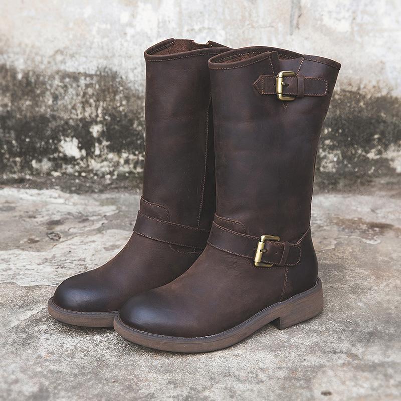 Black buckle boots sleek ankle silhouette with bold statement hardware accent straps