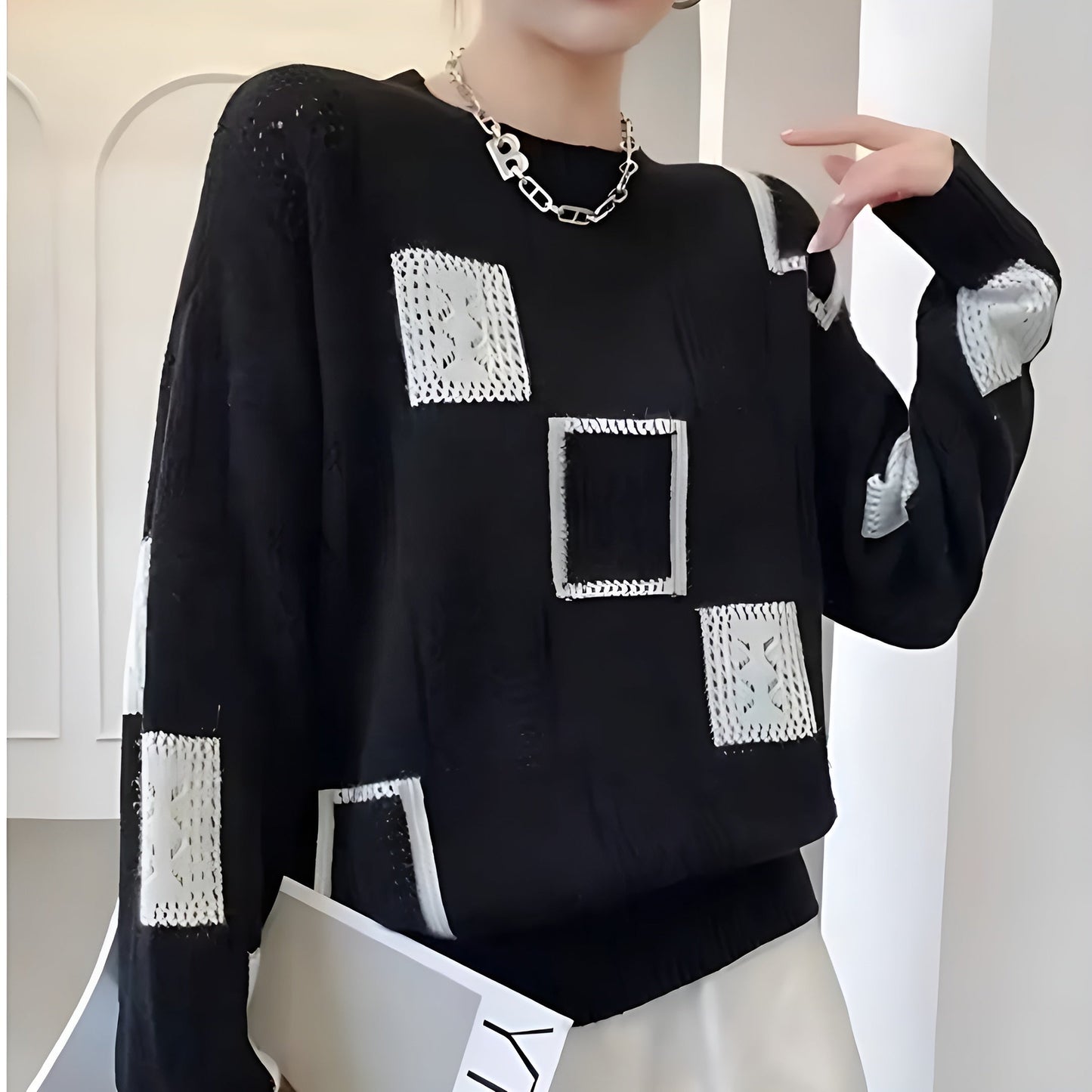Elegant square pattern cream sweater with soft flattering fit and chic contemporary knit design