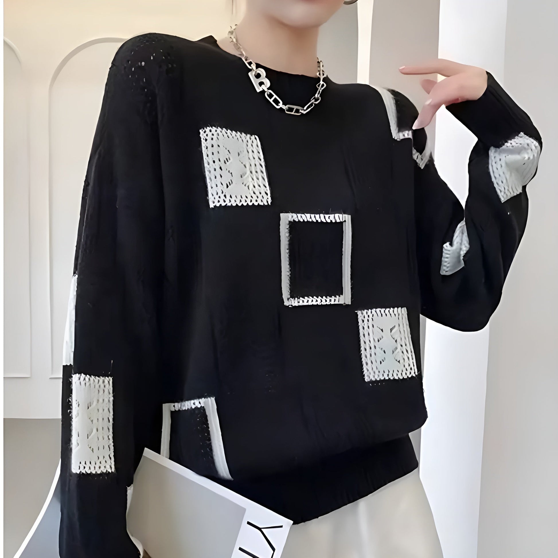 Elegant square pattern cream sweater with soft flattering fit and chic contemporary knit design