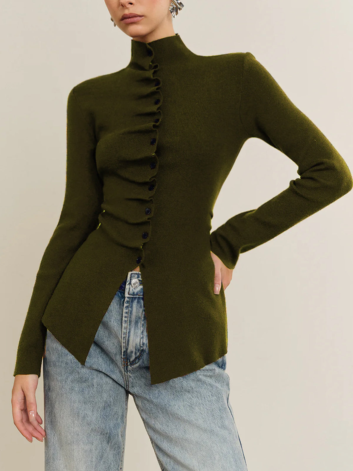Casual knit long sleeve top with button detail, pleated design, and split hem in regular fit