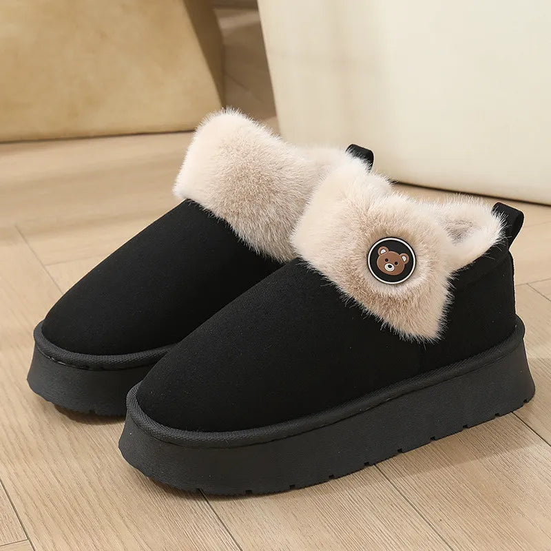 Cozy ankle-high slipper boots with faux fur trim, button detail, and plush fleece interior