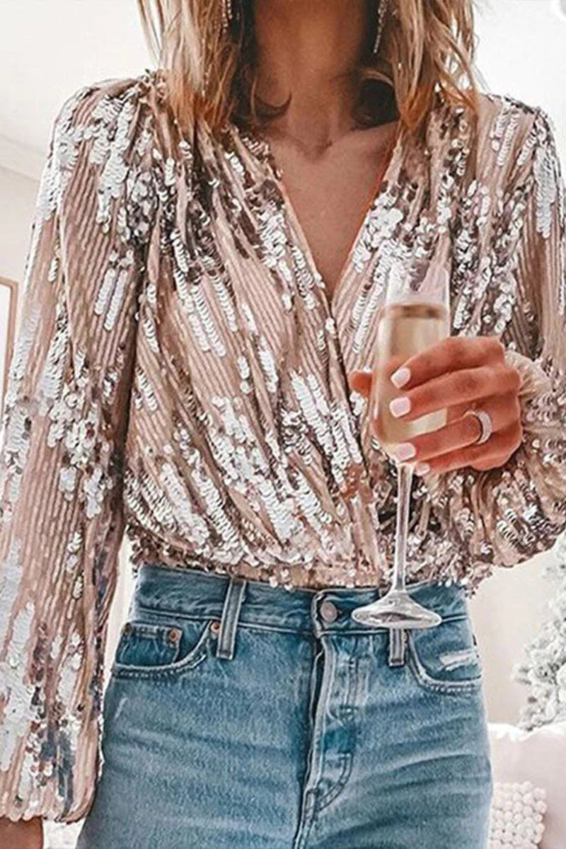 Silver sequin party top with deep V-neckline, puff sleeves, and curve-hugging fit for glamorous nights