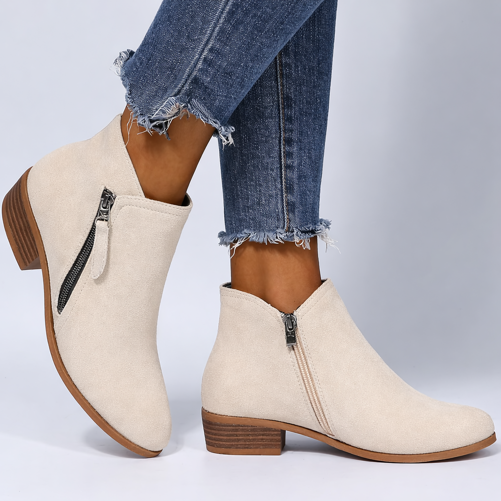 Women's black ankle boots side-zip low heel sleek feminine silhouette everyday chic style
