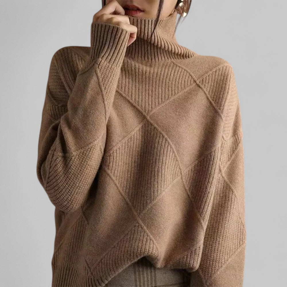Women's oversized turtleneck sweater relaxed silhouette bold patterned texture winter layer