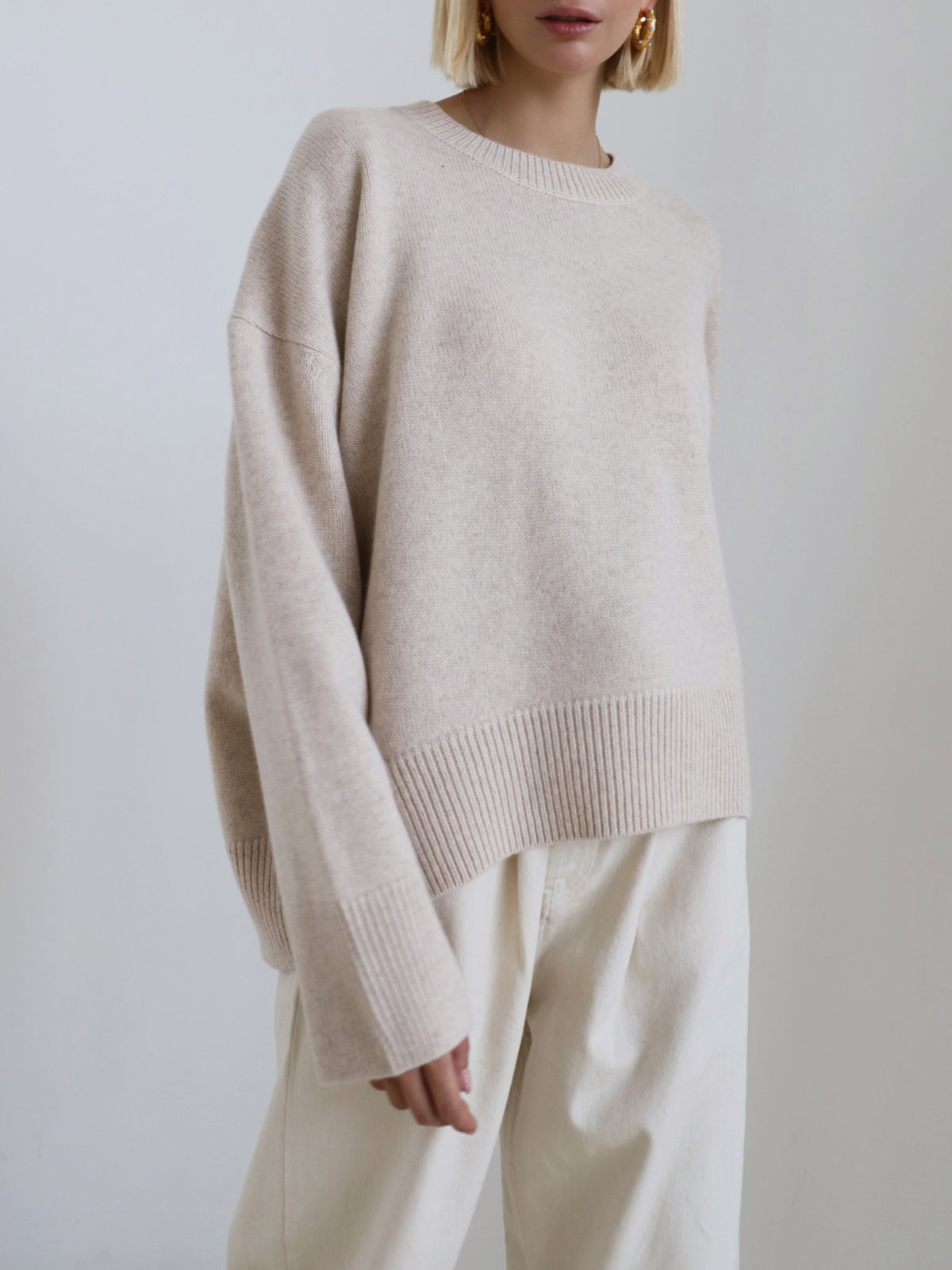 Candyfloss pink oversized pullover knit sweater with relaxed shift fit and medium stretch
