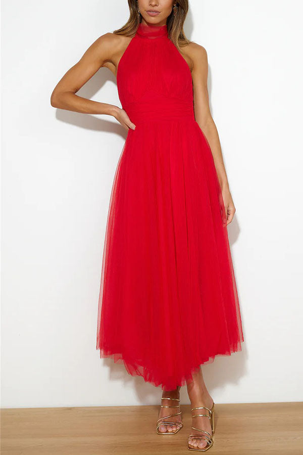 Women's ivory tulle wedding guest dress with flowing layers, fitted waist, and elegant silhouette