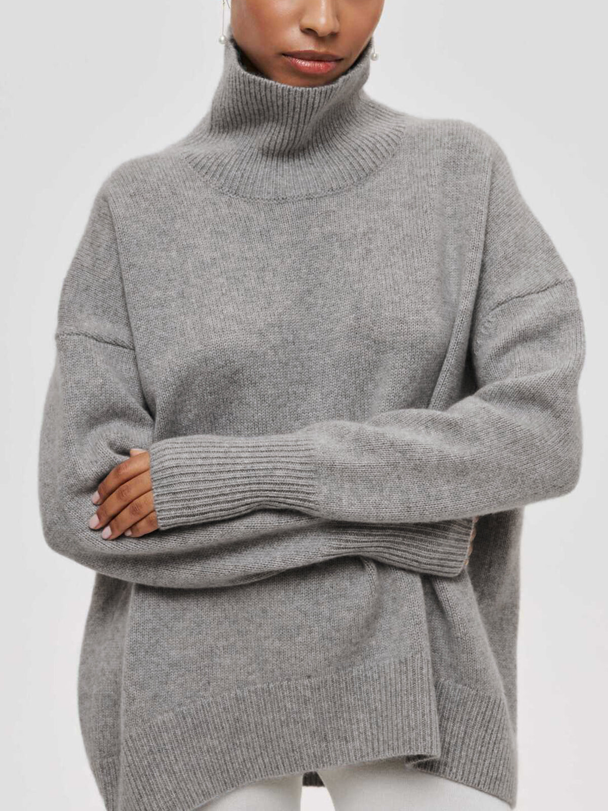 Light blue oversized turtleneck knit sweater with relaxed shift fit and casual style