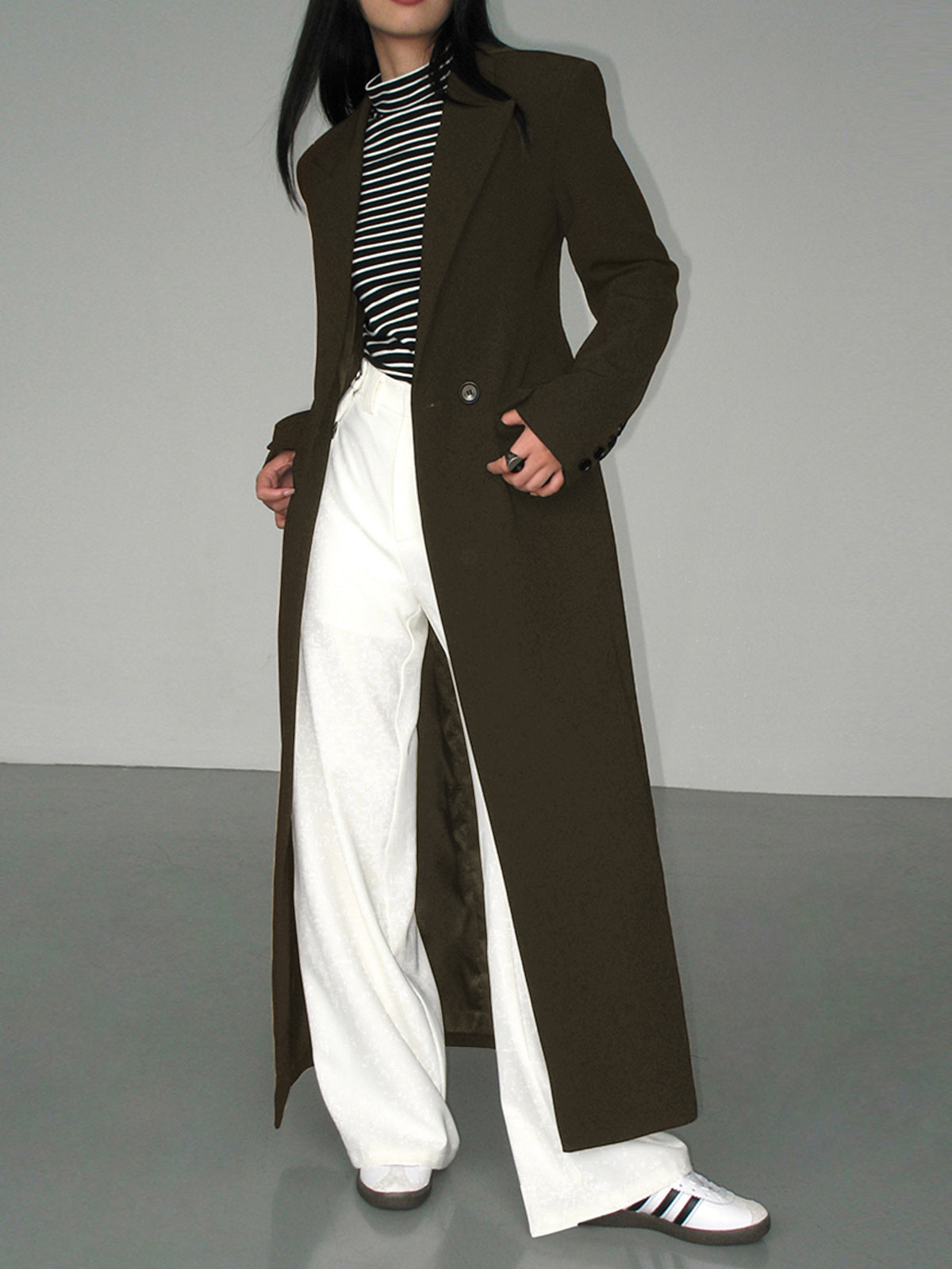 Women's longline tailored blazer coat with collar detail and functional pockets, polished structured fit