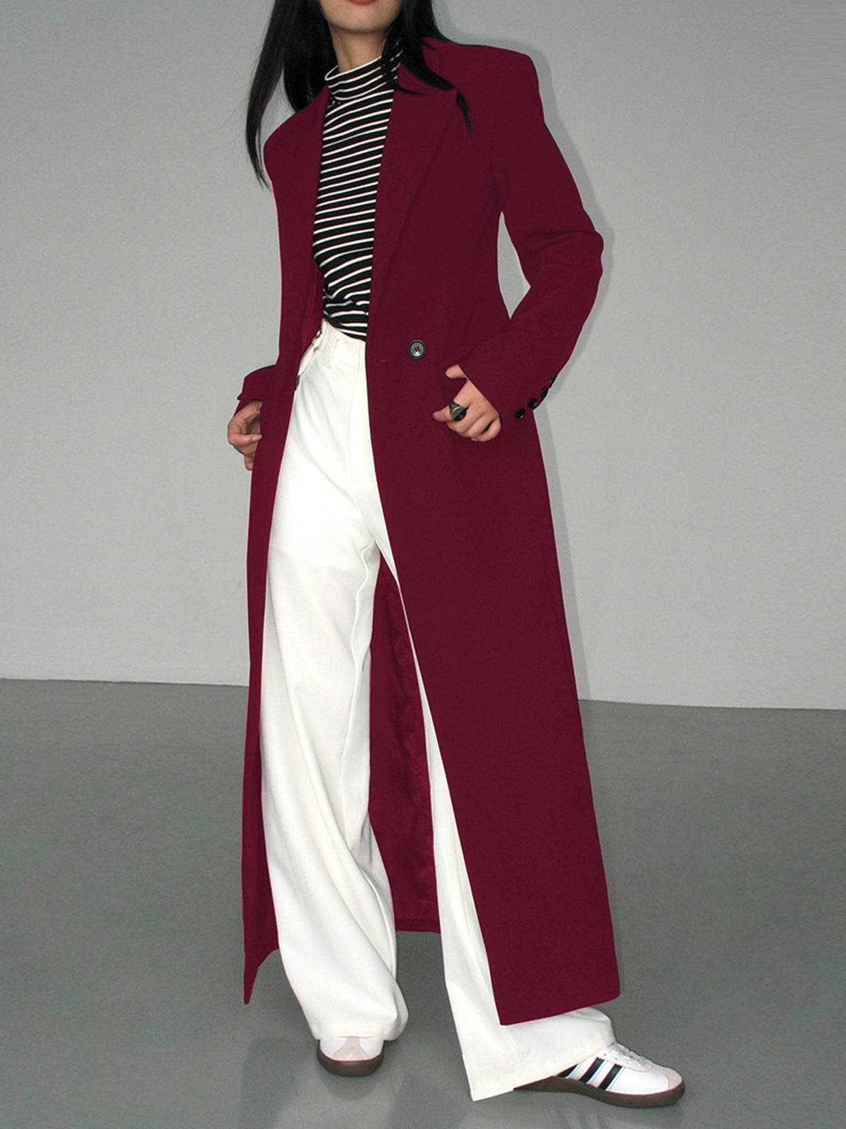 Women's longline blazer coat with collar neckline, structured tailored silhouette, and functional pockets