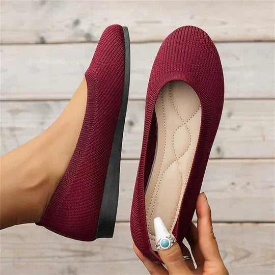 Beige cushioned indoor slippers with contoured footbed, adjustable fit, and textured non-slip sole