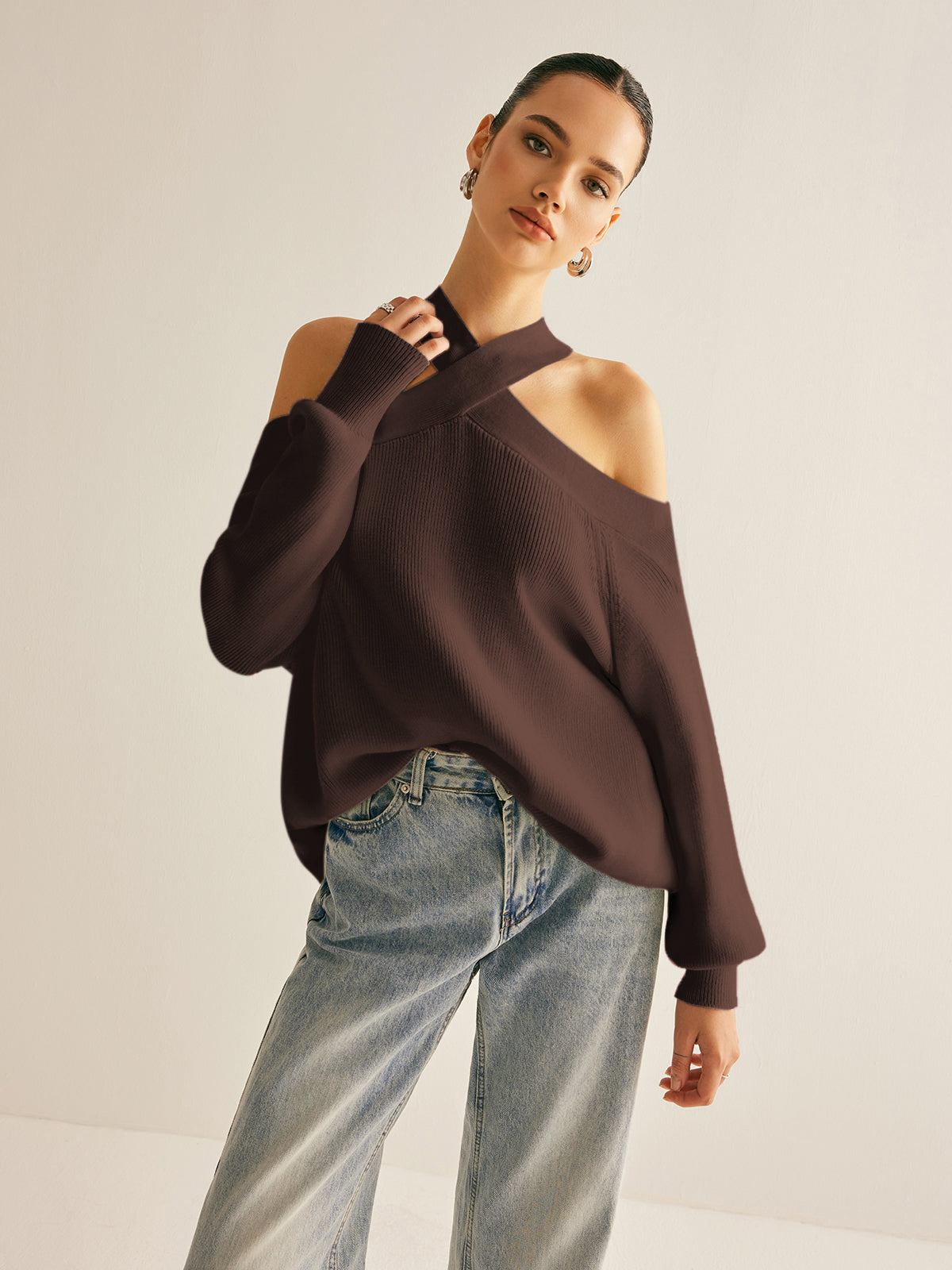 Ivory knit cold-shoulder sweater with crossover collar halter design, casual elegant shift fit