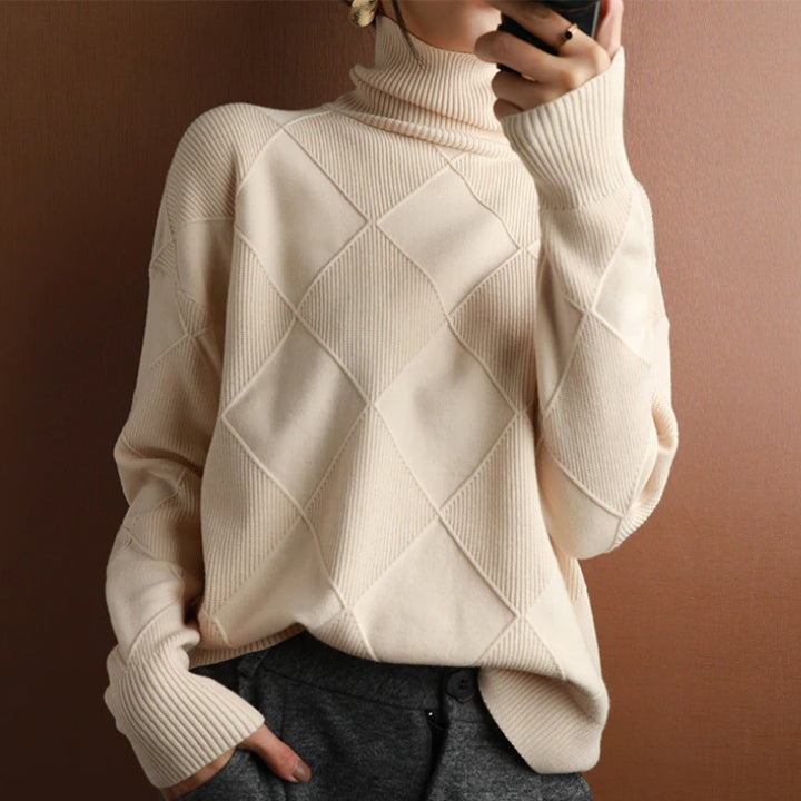 Women's oversized ribbed knit sweater in cozy neutral tones with relaxed silhouette and drop shoulders
