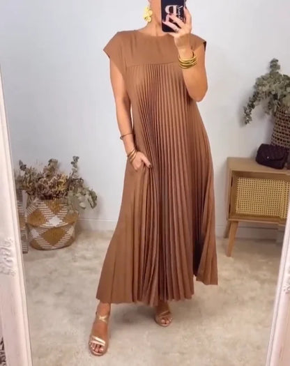 Women's flowy pleated maxi dress in elegant cocktail style with graceful elongated silhouette