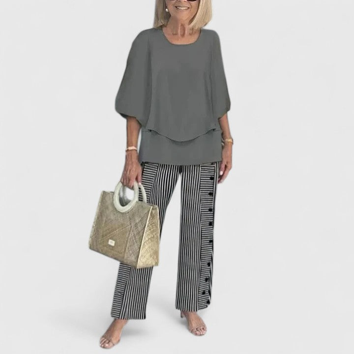 Sage green floral two-piece set with layered relaxed top and wide-leg botanical print pants