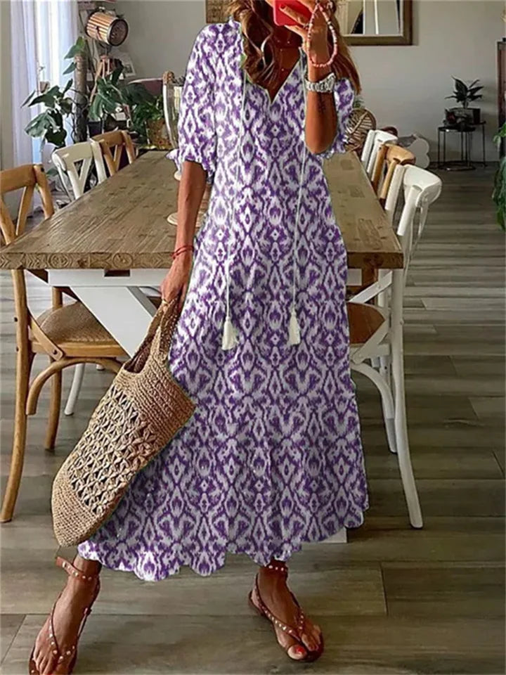 Floral maxi dress with tassel-tie V-neck in romantic boho print, breezy feminine silhouette