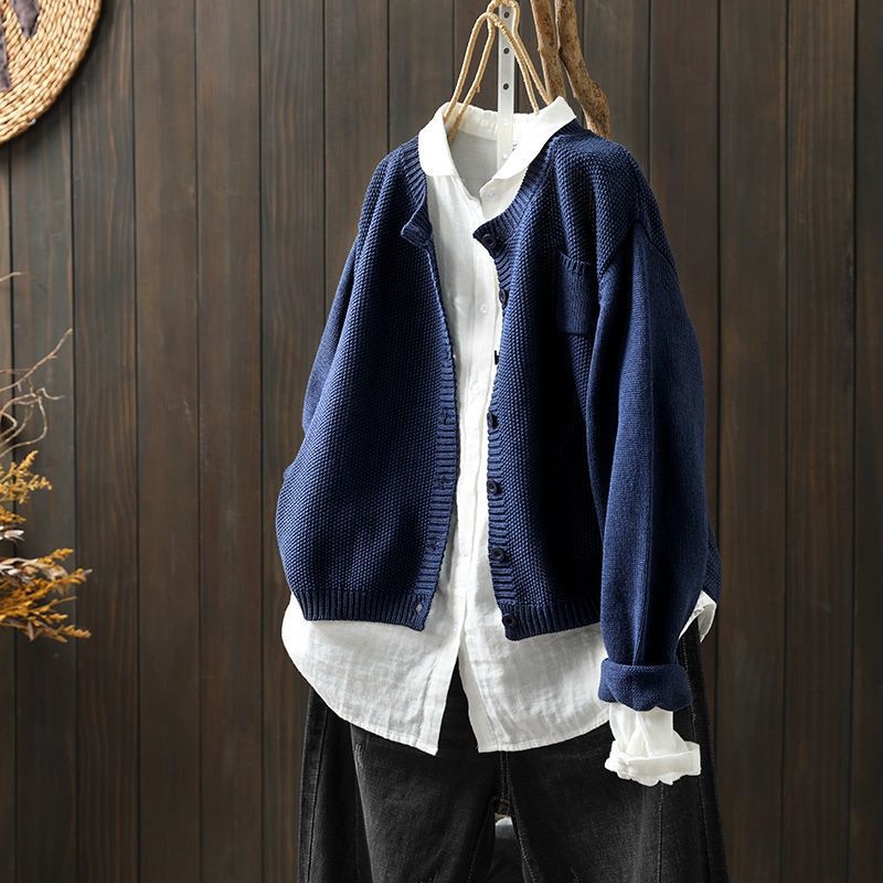 Women's beige relaxed knit cardigan with cozy soft fabric and front button detail for layering