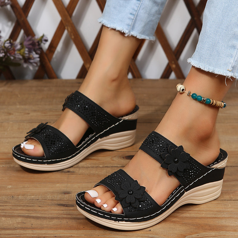Women's floral wedge slides with cushioned sole and delicate feminine accents for all-day comfort