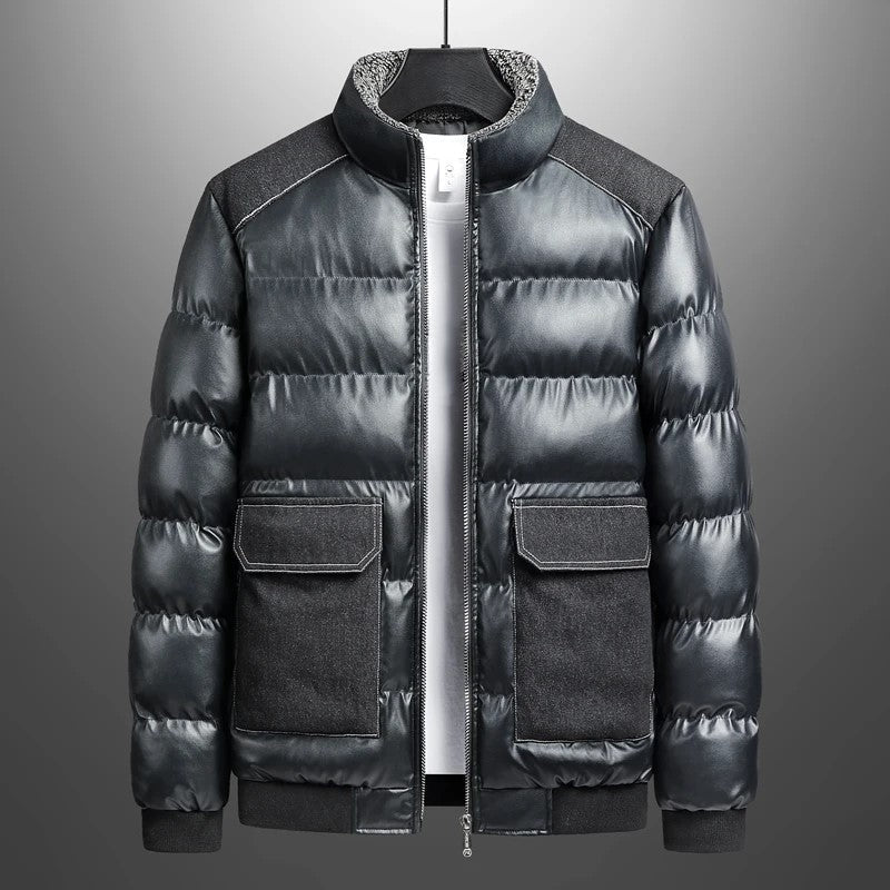 Black puffer jacket with denim patch pockets and shoulders, sherpa-lined collar, waterproof leather build