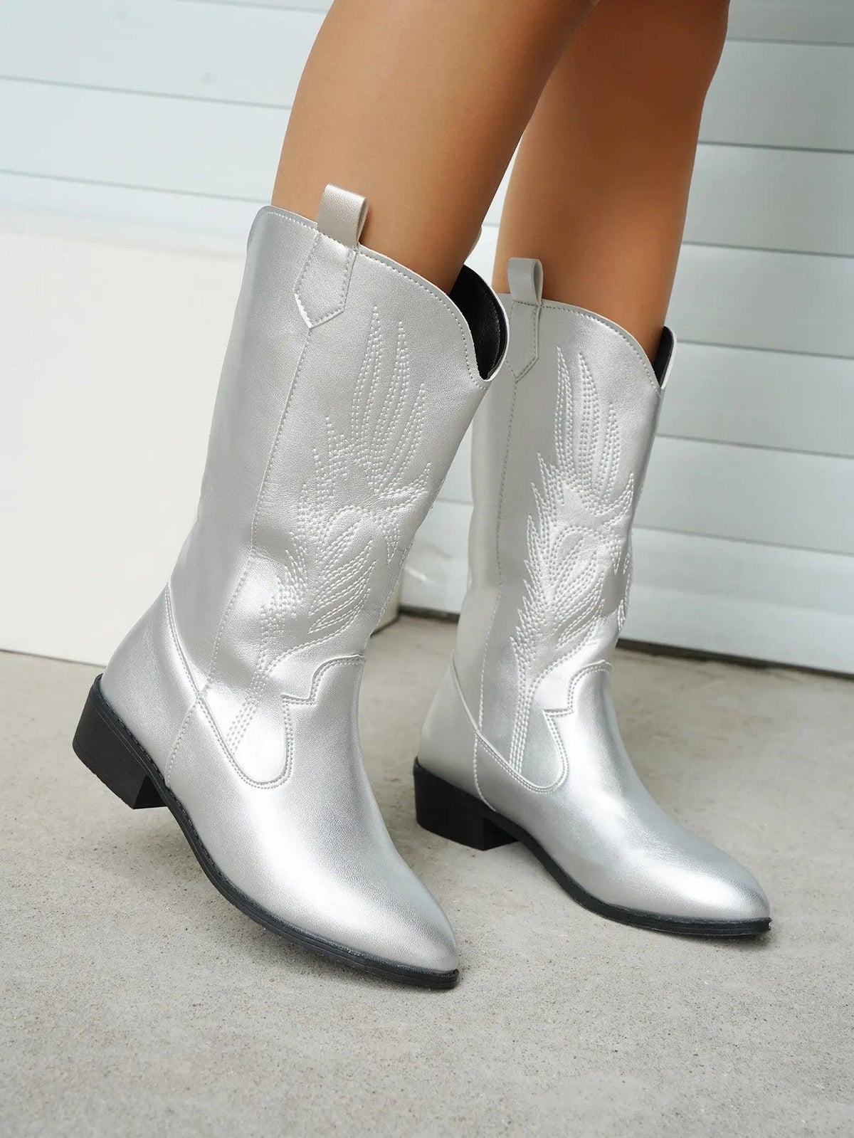 Women's pointed toe western boots in violet with metallic finish, bold contemporary Western style