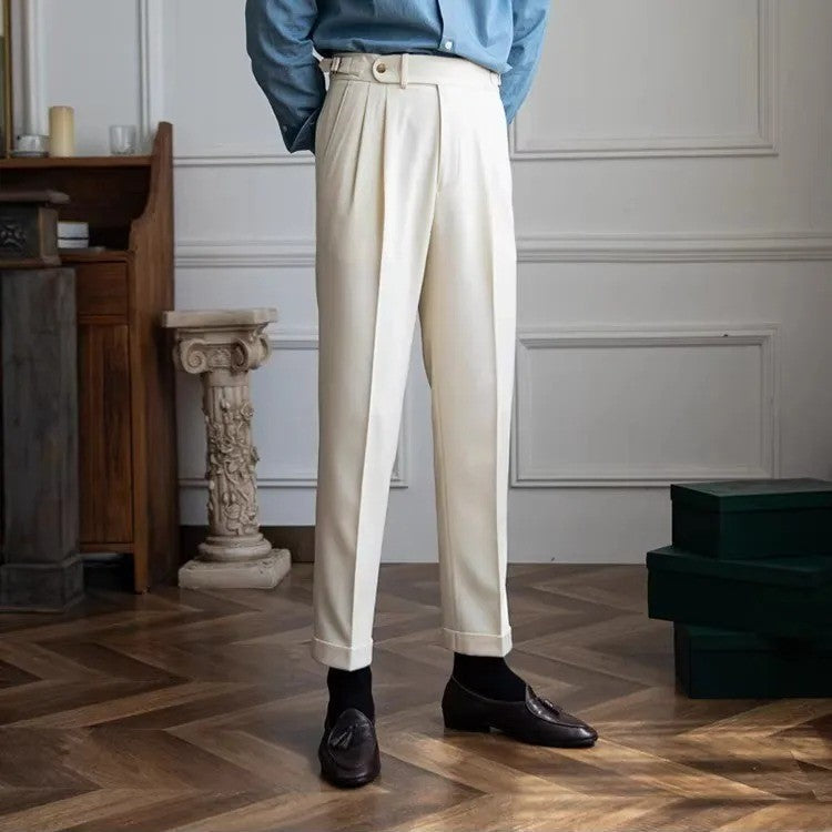 Men's high-waist pleated wool blend trousers in classic tone with belted waistline detail