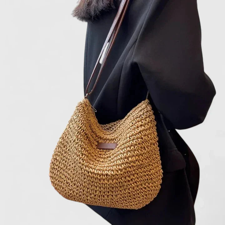 Natural woven shoulder bag in beige neutral tones, lightweight airy design with structured silhouette