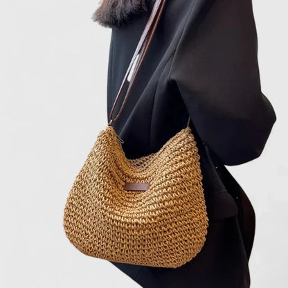 Natural woven shoulder bag in beige neutral tones, lightweight airy design with structured silhouette