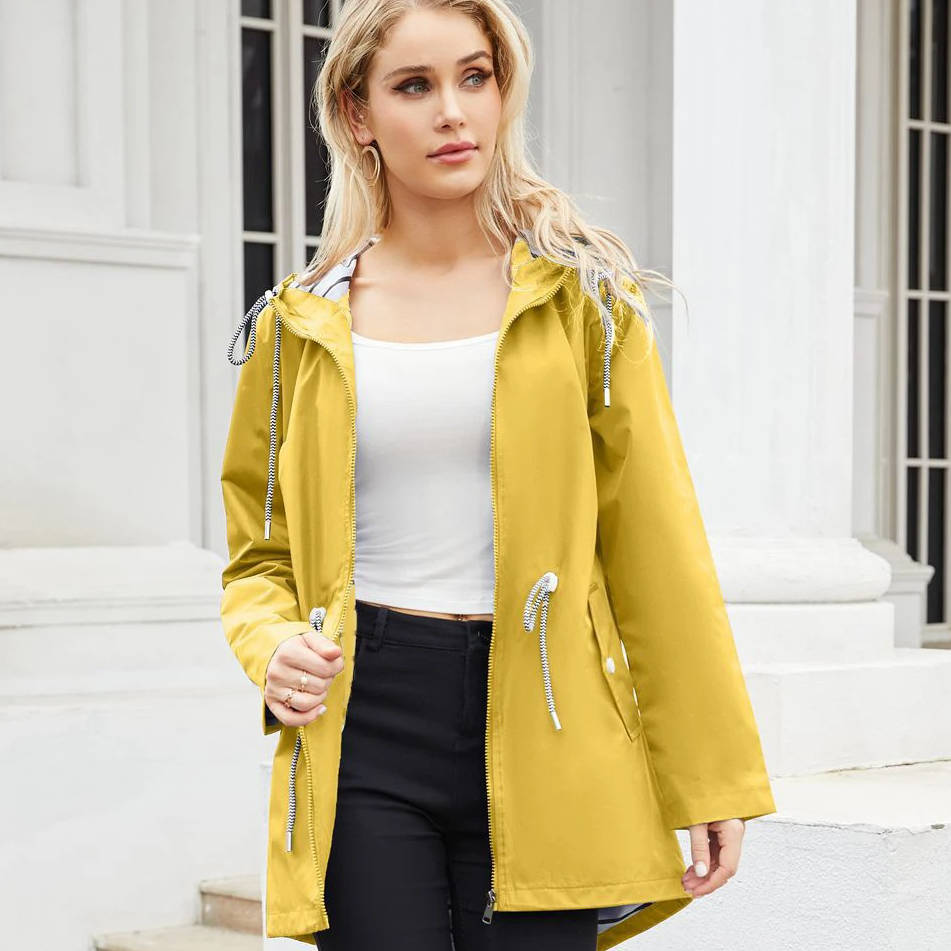 Women's lightweight waterproof rain jacket with hood in neutral tone, packable design for daily commute
