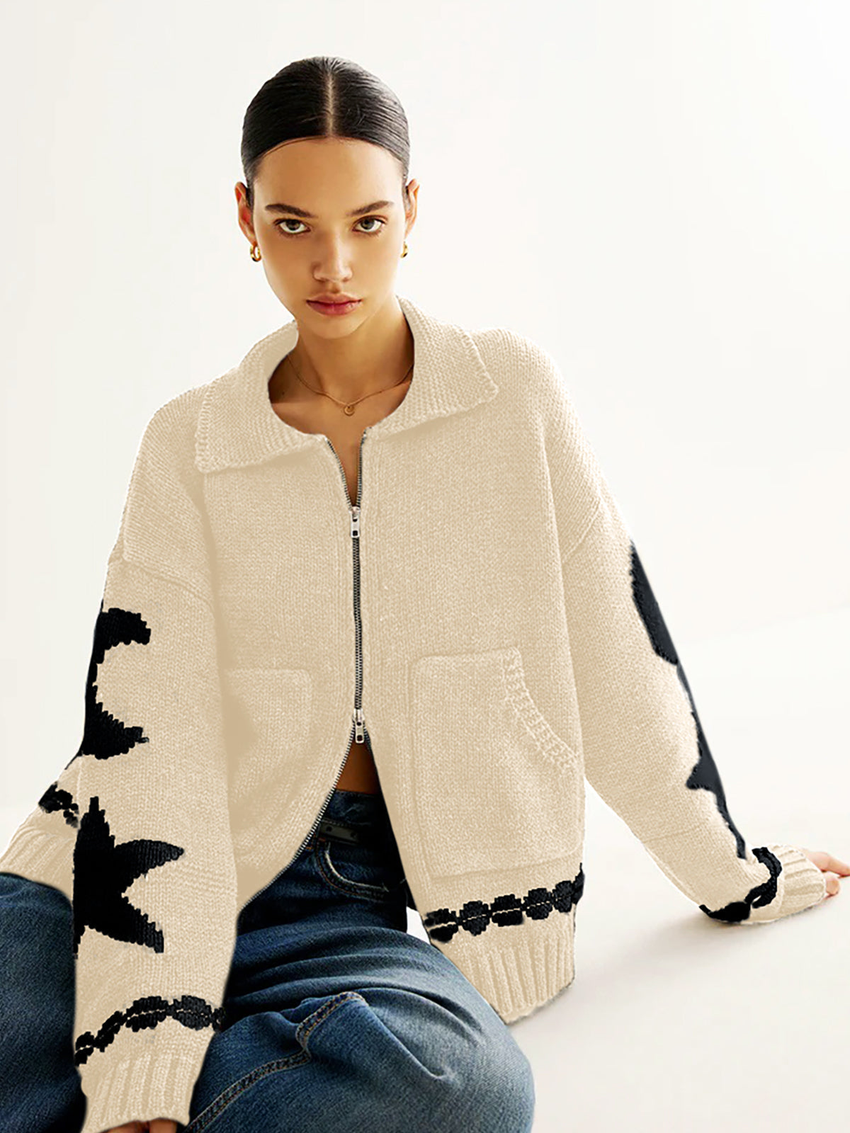 Warm jacquard knit cardigan with lapel collar, double zip pockets, and elegant casual shift fit