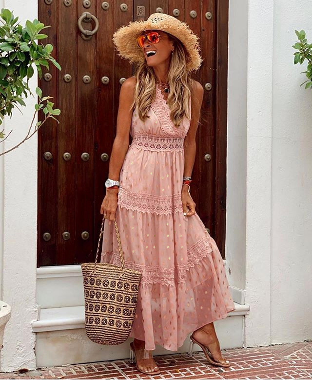 Women's sleeveless maxi dress with flowy fit featuring delicate lace and embroidery detailing