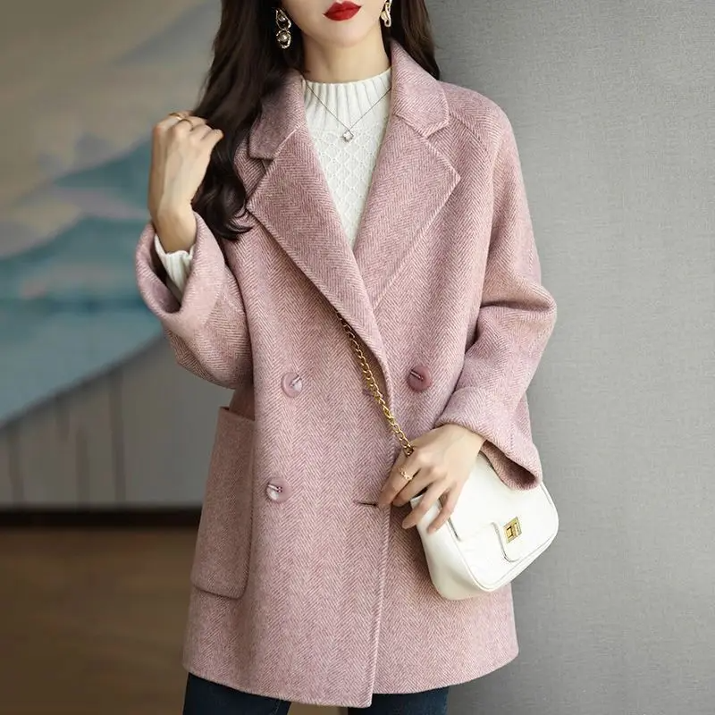 Soft mid-gray slim-fit wool-blend trench coat with double-breasted tailored lapels for professional women