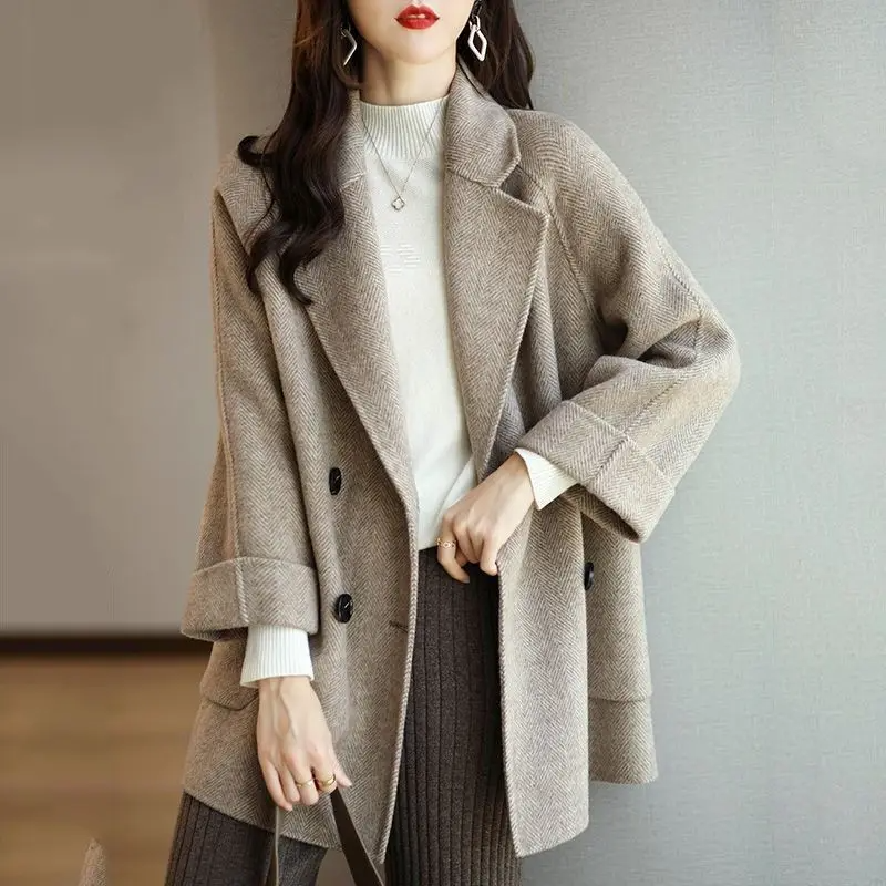 Soft mid-gray slim fit wool-blend trench coat with double breasted tailored lapels for professional women
