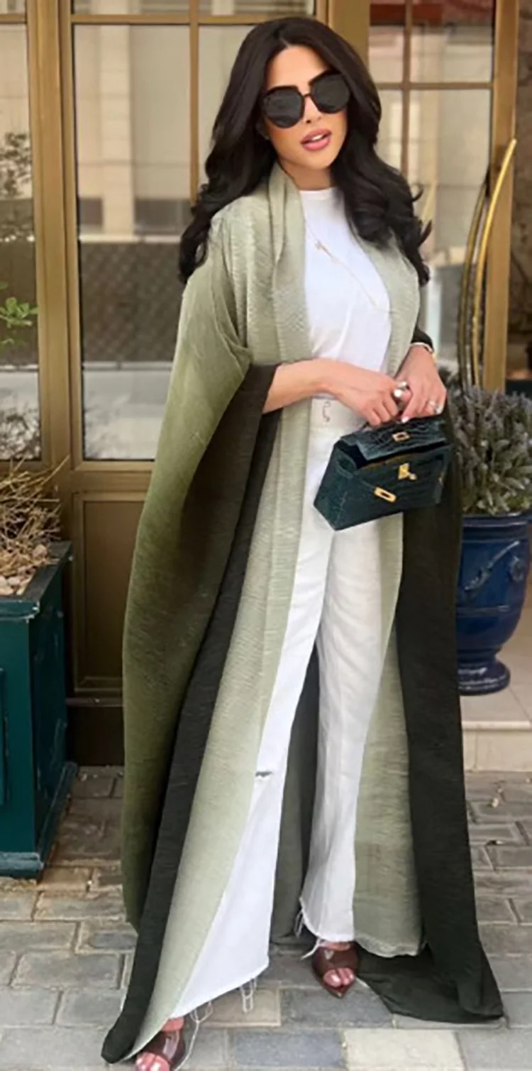Women's oversized trench coat with pleated texture, shawl collar, bat sleeves, and full-length silhouette