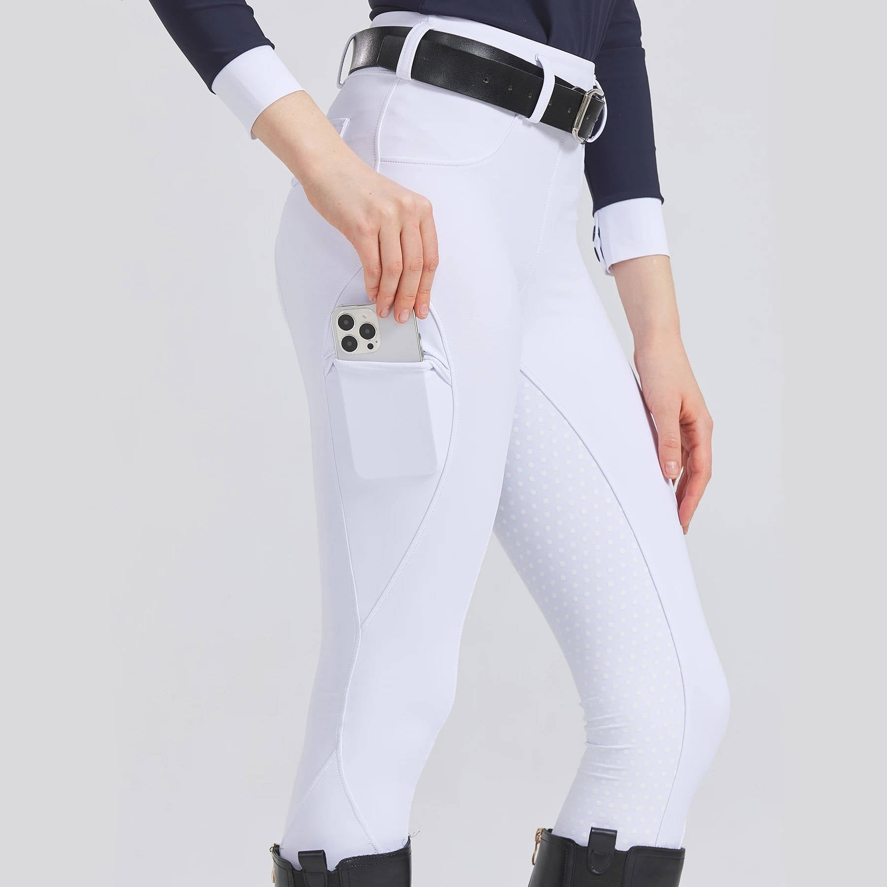 Women's beige equestrian riding pants with full silicone grip from seat to ankle for secure saddle lock