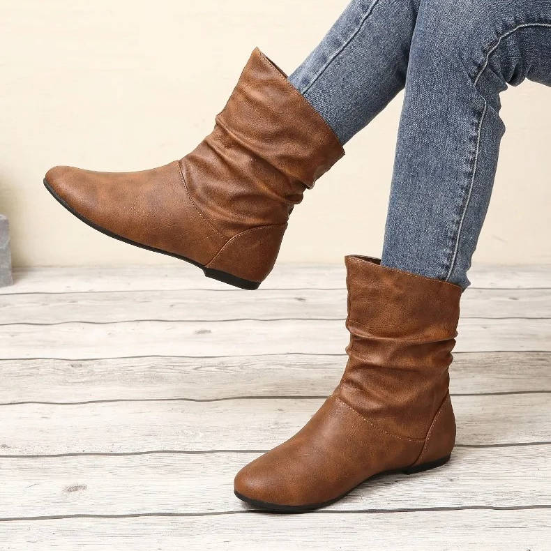 Slouch flat ankle boots in neutral tone, slip-on style with flexible slouchy shaft for effortless wear